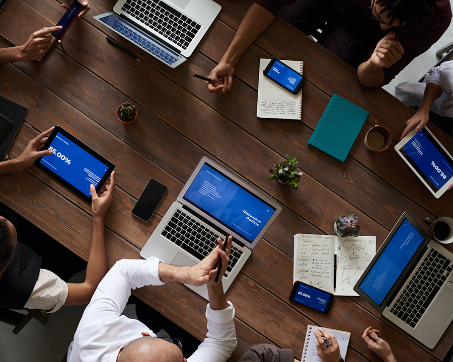 people in a meeting around a table